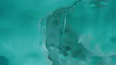Blue crystal ice cave beneath the glacier in Iceland Stock Footage 324108645