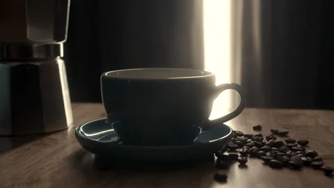 Blue cup of evaporating coffee on the table with roasted bean. Coffee blue cup Stock Footage 272839856