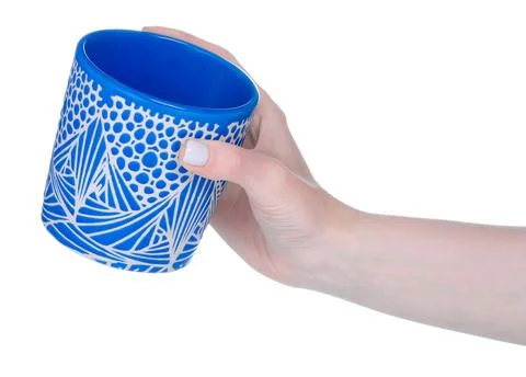 Blue cup mug in hand Stock Photos