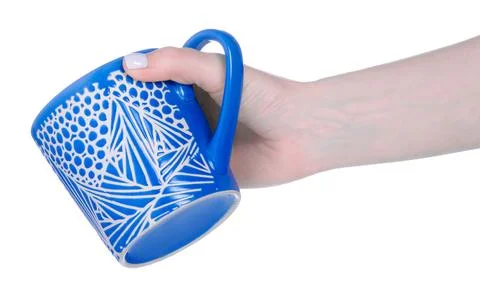 Blue cup mug in hand Stock Photos
