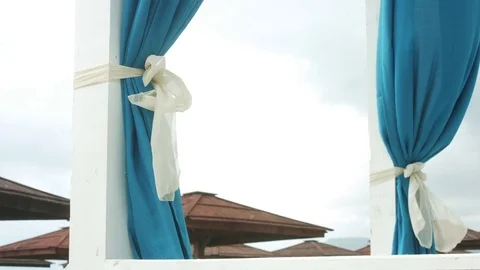 Blue curtains fluttering in the wind. Stock Footage 78494444