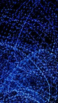 Blue dashed lines of lights on a black background Stock Photos