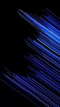 Blue dashed lines of lights on a black background 스톡 사진
