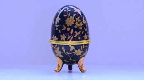 Blue decorative eggs with a gold pattern Stock Photos