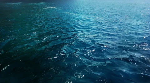 Blue deep sea waves with foam slowly sailing on the surface of water Stock Footage 55199138