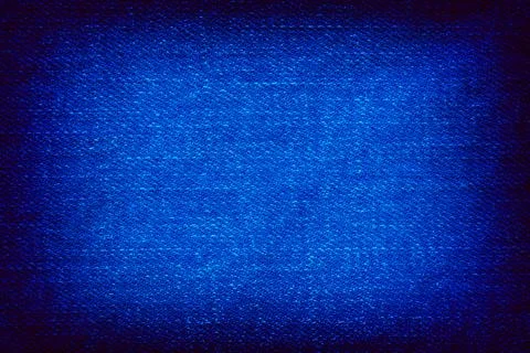 Blue denim background with deep vignetting Stock Photos