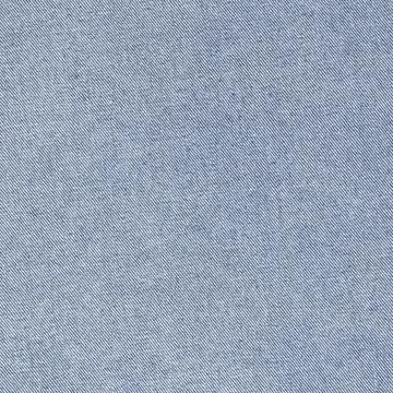 Blue denim fabric texture background. Detailed closeup of cotton textile for  Фото