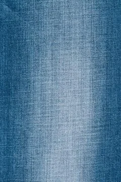 Blue denim fabric texture background with faded detail and classic weave Stock Photos
