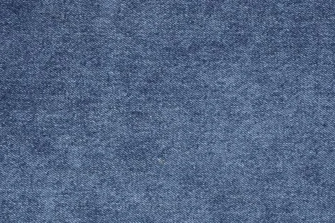 Blue denim fabric texture background. Close up view of material surface. Fa.. Фото