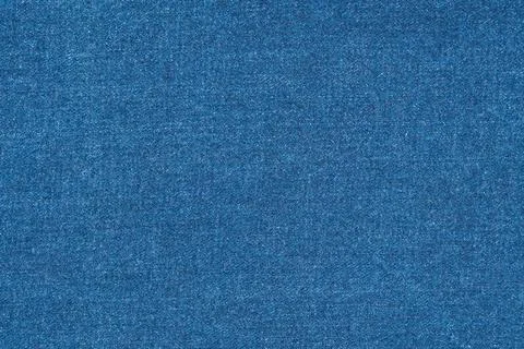 Blue denim fabric texture background. Closeup classic jeans material with w.. Fotos Stock