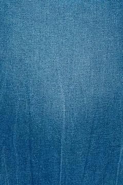 Blue denim fabric texture with diagonal weave and faded gradient Stock Photos