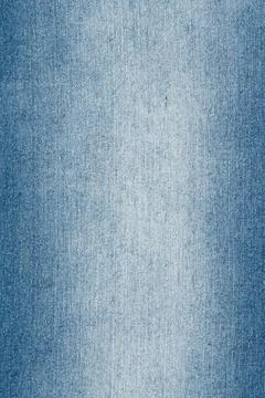 Blue denim fabric texture with gradient. Abstract cotton material background. Stock Photos