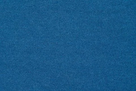 Blue denim fabric texture surface. Detailed jeans material closeup. Cotton .. 写真素材
