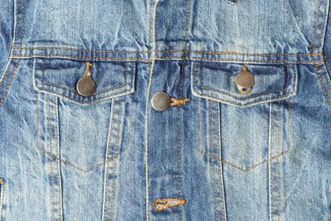 Blue denim jacket with two pockets, close up Stock Photos