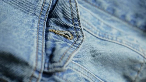 Blue denim jeans fabric texture background Video stock 340926686
