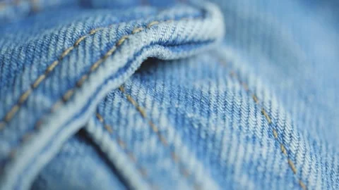 Blue denim jeans fabric texture close up Stock Footage 340926789
