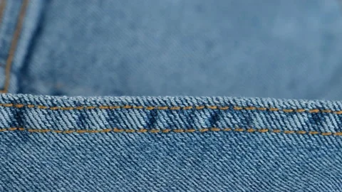 Blue denim jeans stitching  macro.  stitching on jeans Stock Footage 149978555