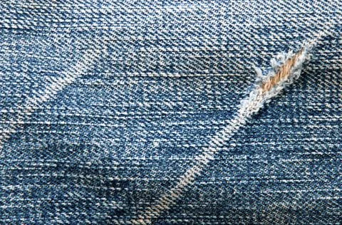 Blue denim texture with scratch Stock Photos