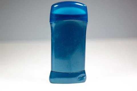 A blue deodorant stick on a white surface Stock Photos