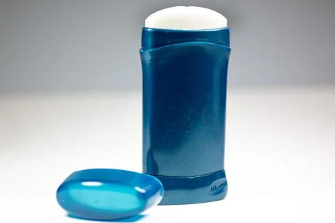 A blue deodorant stick on a white surface Stock Photos