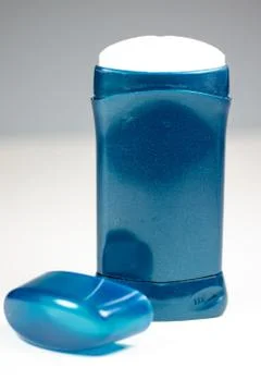 A blue deodorant stick on a white surface Stock Photos