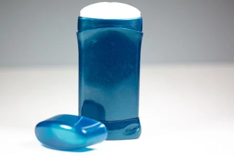 A blue deodorant stick on a white surface Stock Photos