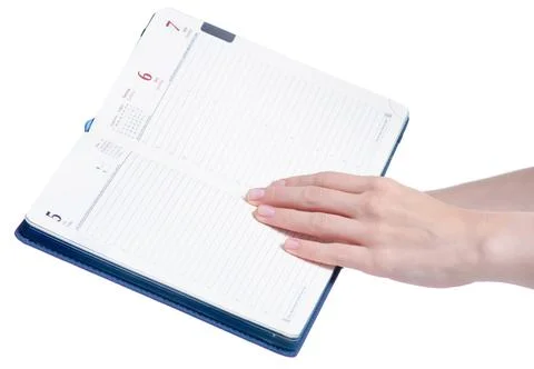 Blue diary notepad notebook in hand Stock Photos