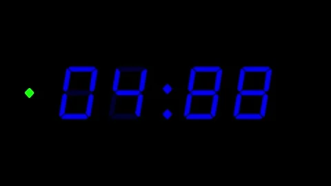 Blue digital clockface with 4 digits and green accent dot. 30 seconds digital Stockbeeldmateriaal 331093726