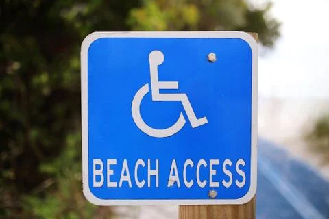 Blue Disabled Beach Access Sign at Public Ocean Access Path Stock Photos
