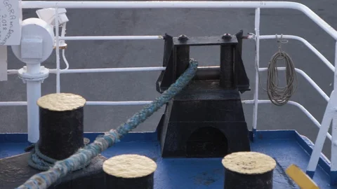 Blue Docking rope sliding on a ferry. Close-up on bow of white ship. Video stock 101586261