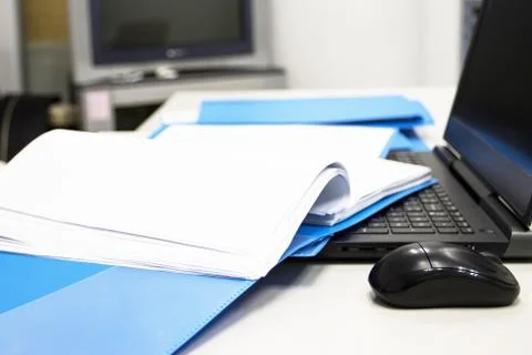Blue Document folder with Notebook on table at office Photos