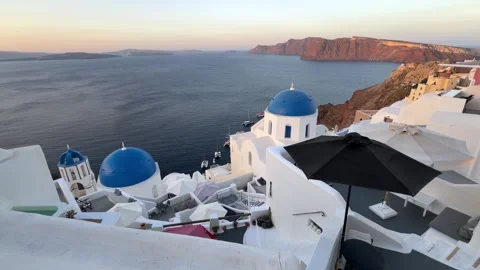 Blue Dome Churches at Golden Hour in Oia, Santorini, Greece 2026/09/24 Stock Footage 346319491