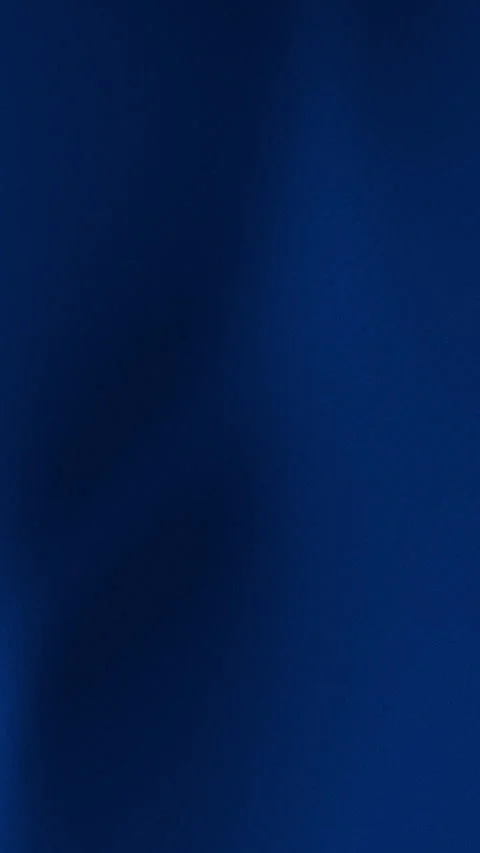 Blue is the dominant hue of this dark solid background.vertical Видео 306379226
