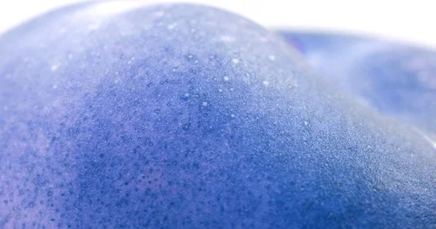 Blue donut peach isolated rotates on itself on white background. Crazy color. Stock Footage 113458053