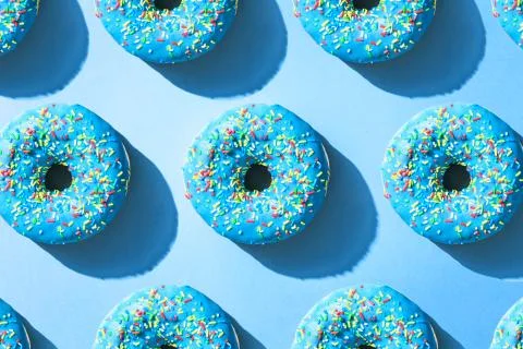 Blue donuts, repetitive pattern. Stock Photos