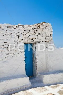 Blue door in mykonos, greece Stock Photos