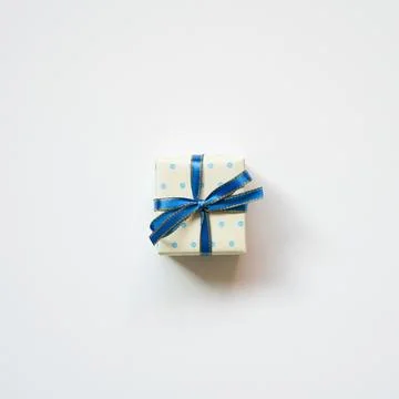 Blue dot pattern ivory gift box isolated on white background. top view Stock Photos