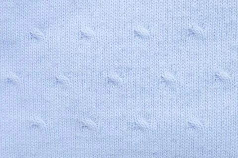 Blue dot stitch knitting pattern. Wavy texture of woolen fabric. Textiles for Stock Photos