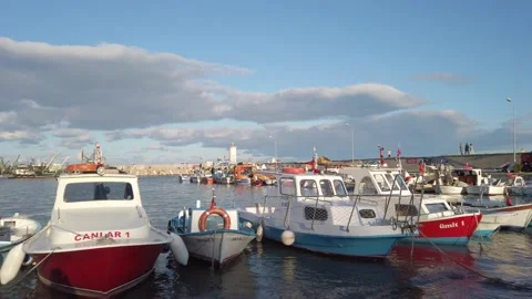 Blue dramatic sky, clouds. Private yachts, fishing boats docked in sea bay. Stock Footage 145769448