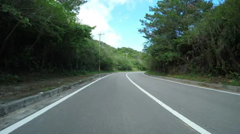 Blue drive through the beautiful oceanside streets of Ishigakijima, Okinawa. Stock Footage 61547078
