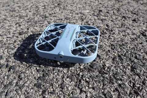 Blue drone on the ground outside Stock Photos
