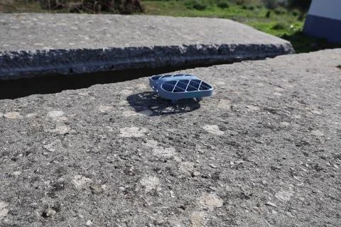 Blue drone on the ground outside Stock Photos