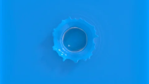 Blue drop falling in slow motion in blue paint Stock Footage 109624991
