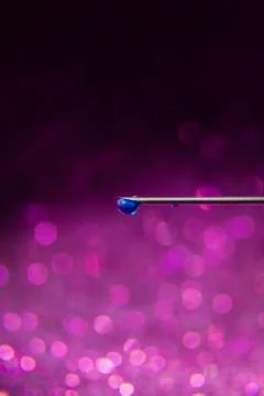 Blue Drop on Point of the Needle Stock Photos