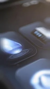 Blue droplet button among utility controls Stock Photos
