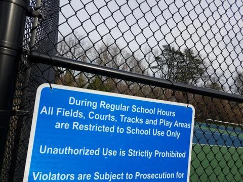 Blue during regular school hours courts restricted to school use only Stock Photos