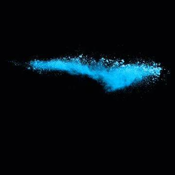 Blue dust explosion on black background. Freeze motion of color powder splash Stock Photos
