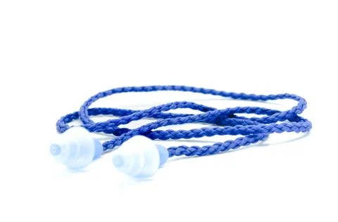 Blue earplugs with a string on white background. Stock Photos