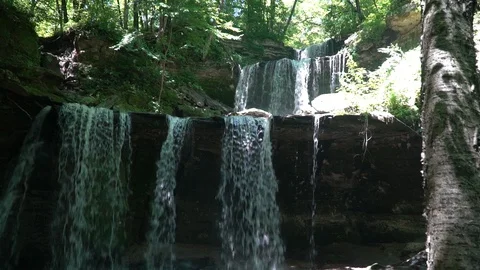 Blue Earth River Triple Falls waterfall medium shot Stock Footage 128903423