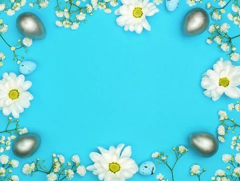 Blue Easter background. Flowers and eggs. Bright space for your text Stock Photos